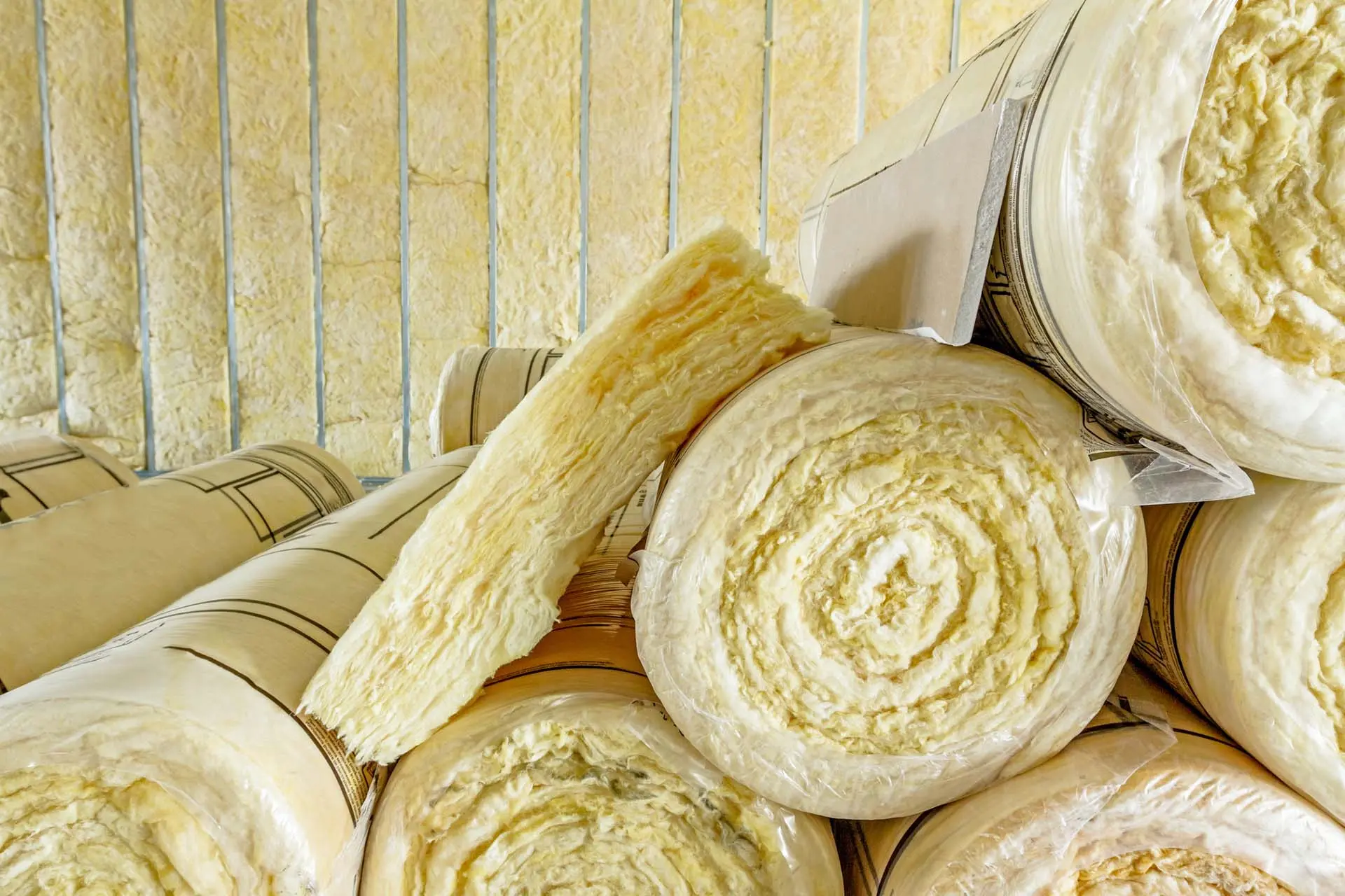 Insulation rolls stacked for building insulation use.
