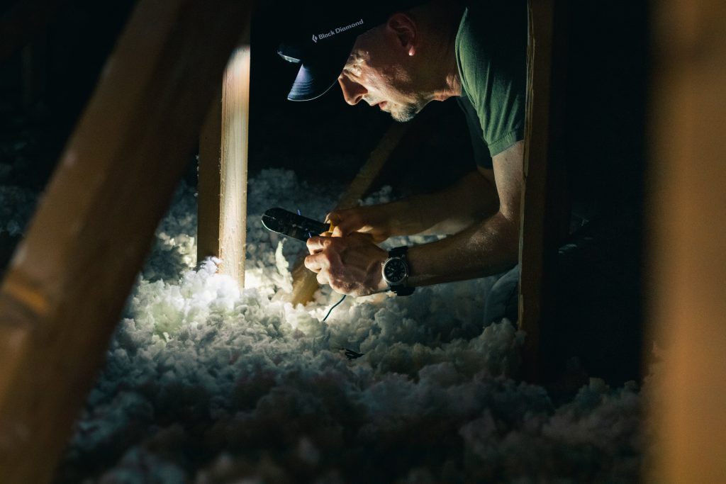 Worker Inspecting Insulation