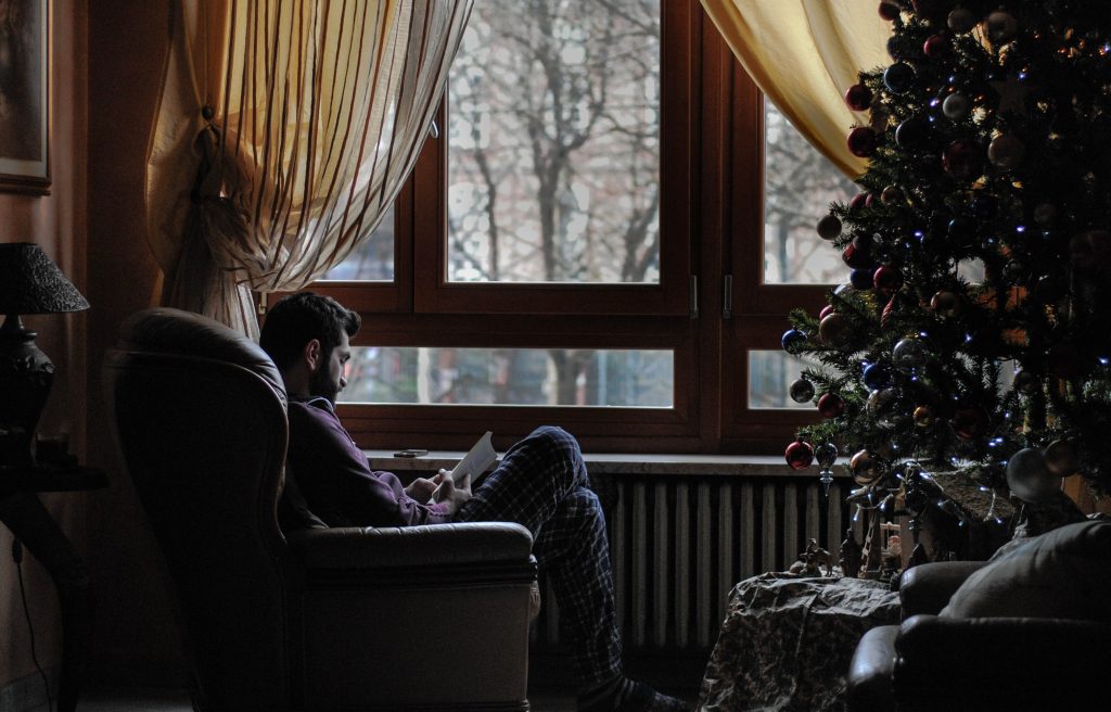 Reading Book Inside the House with the Cold Breeze of Winter Outside.