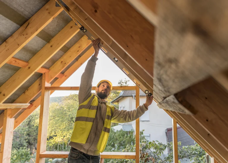 Man working on roof construction.