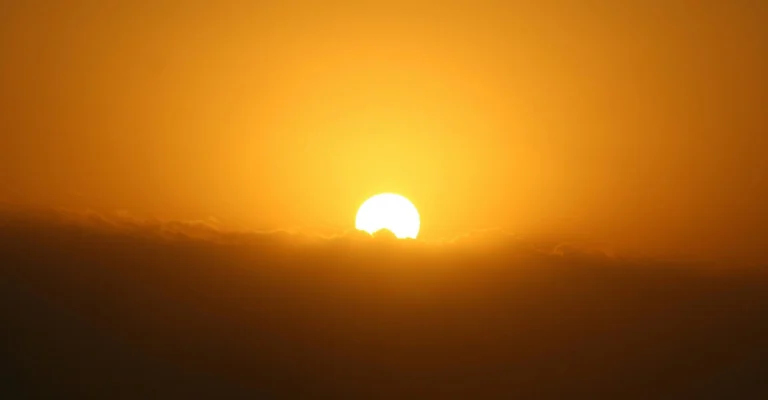 Sunrise above the clouds, warm glow